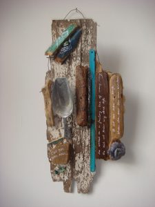 small assemblage with objects and driftwood