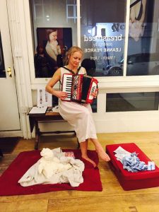 photo of artist playing accordion