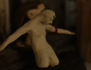 close up of a small fragmented ceramic figure